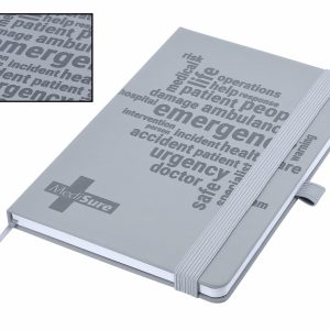 A grey A5 notebook with debossed text and a ribbon bookmark, featuring a logo on the cover.