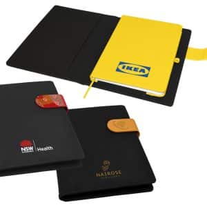 A multi-coloured portfolio featuring a yellow notebook, a black cover with a logo, and decorative closures.
