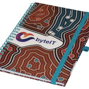 A A5 side-bound notebook with a distinctive Aboriginal art design in brown, red, and blue, featuring a logo on the cover.