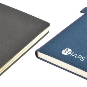 Two Tab Deluxe A5 Notebooks in grey and navy, featuring a logo on the cover. Both have a sleek design with a closure.