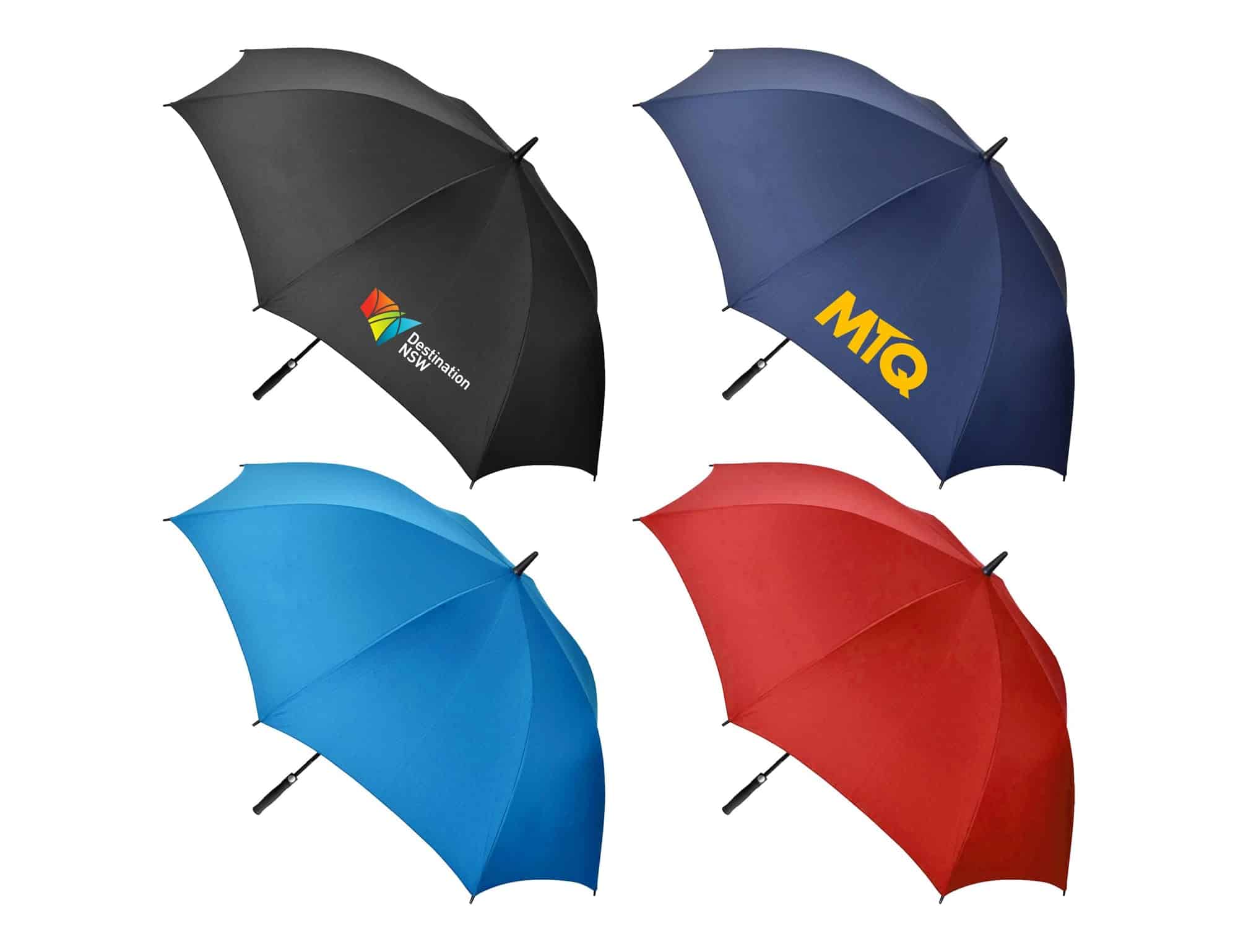 A collection of four golf umbrellas in black, blue, red, and a logoed design. Each umbrella features a sturdy handle.
