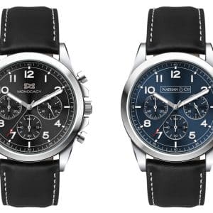 A unisex Chrono watch with a black leather strap, featuring two dial options: black and blue. Each has a branded logo.