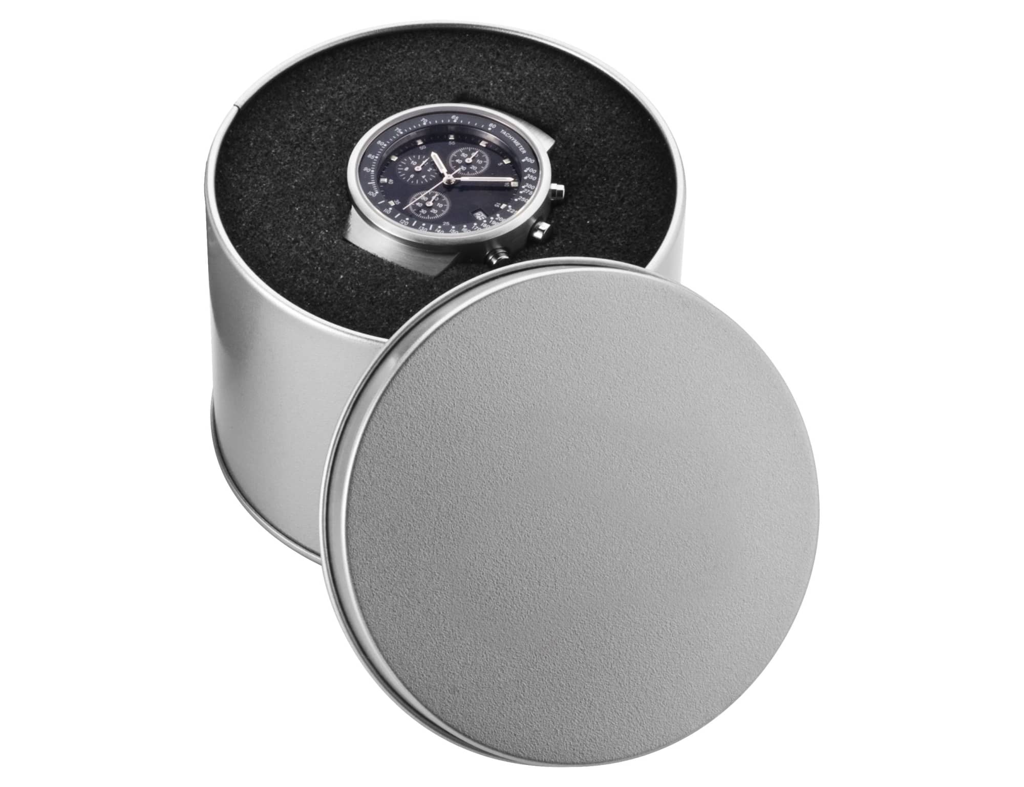 A round silver watch case containing a dark watch, set against a textured black background.