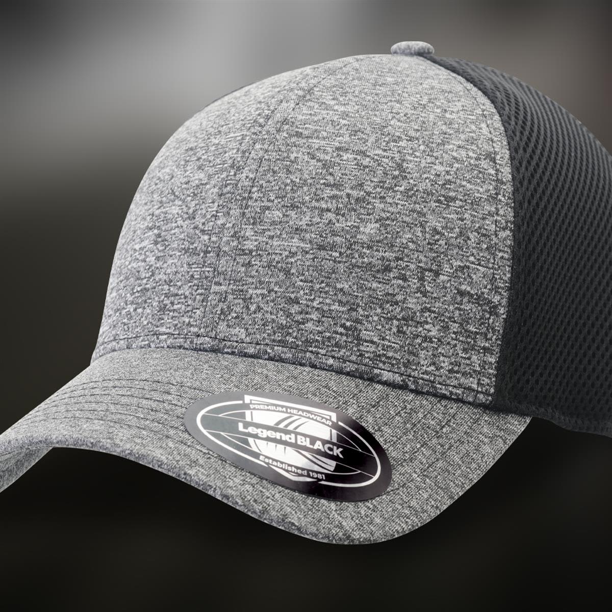 A grey and black trucker cap featuring a textured design and a branded sticker on the brim.