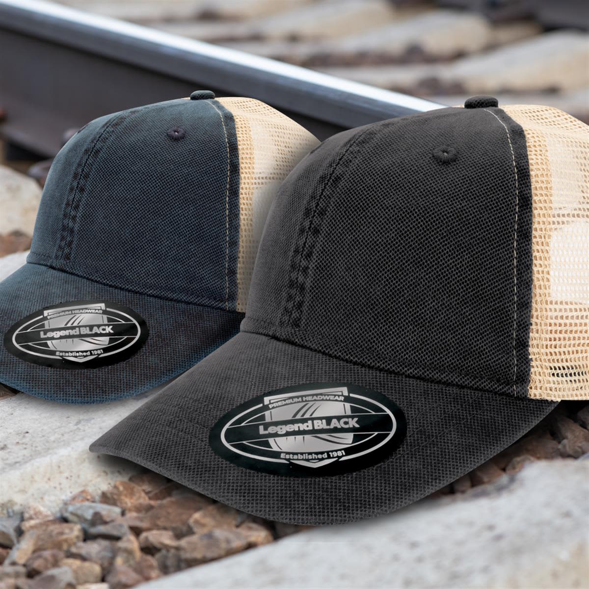 Two caps in black and dark blue with mesh backs, featuring a logo on the front.