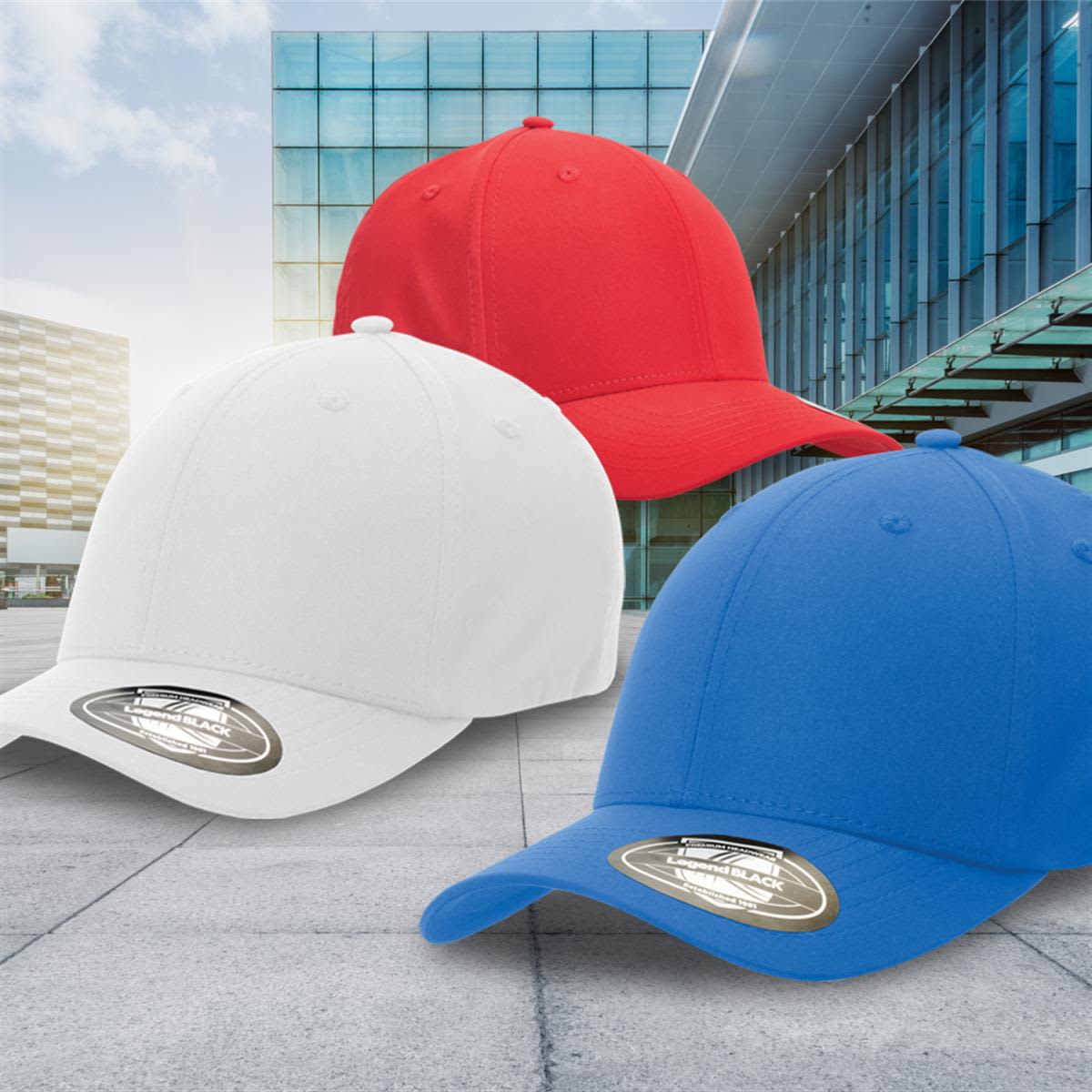 A set of three caps in red, white, and blue, featuring a logo on the brim, displayed outdoors against a building backdrop.
