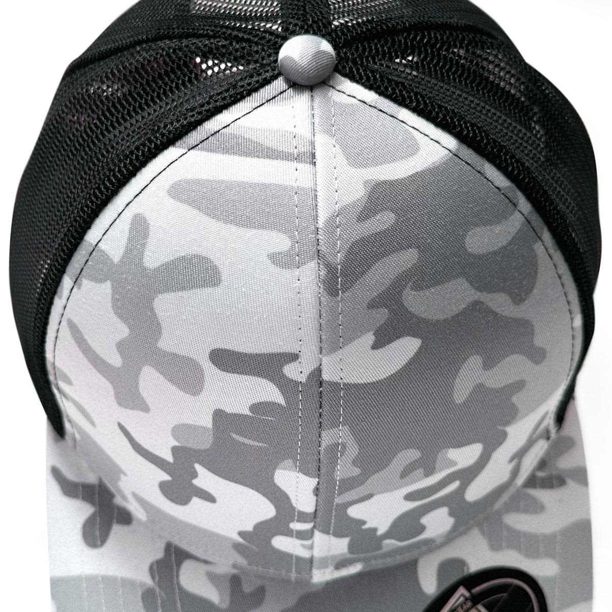 A grey and black trucker cap featuring a snow camouflage pattern and a mesh back, with a circular button on top.