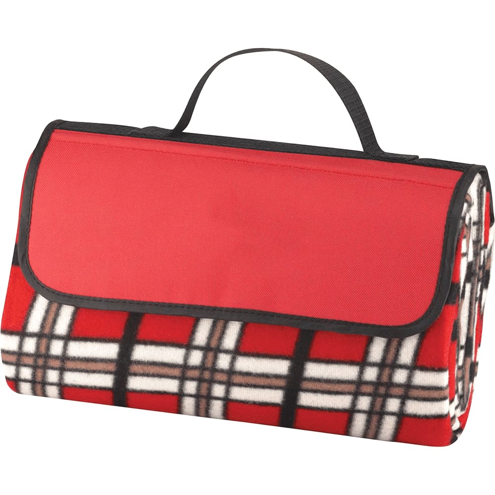 A folded picnic blanket in red with a black and white tartan pattern, featuring a carrying handle.
