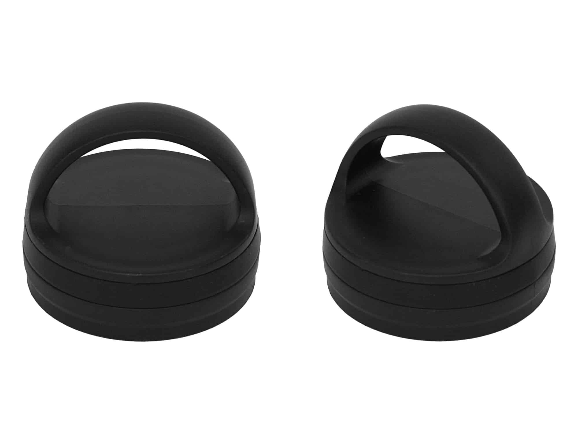 Two black vacuum lids for bottles, featuring a handle design, stacked on top of each other.