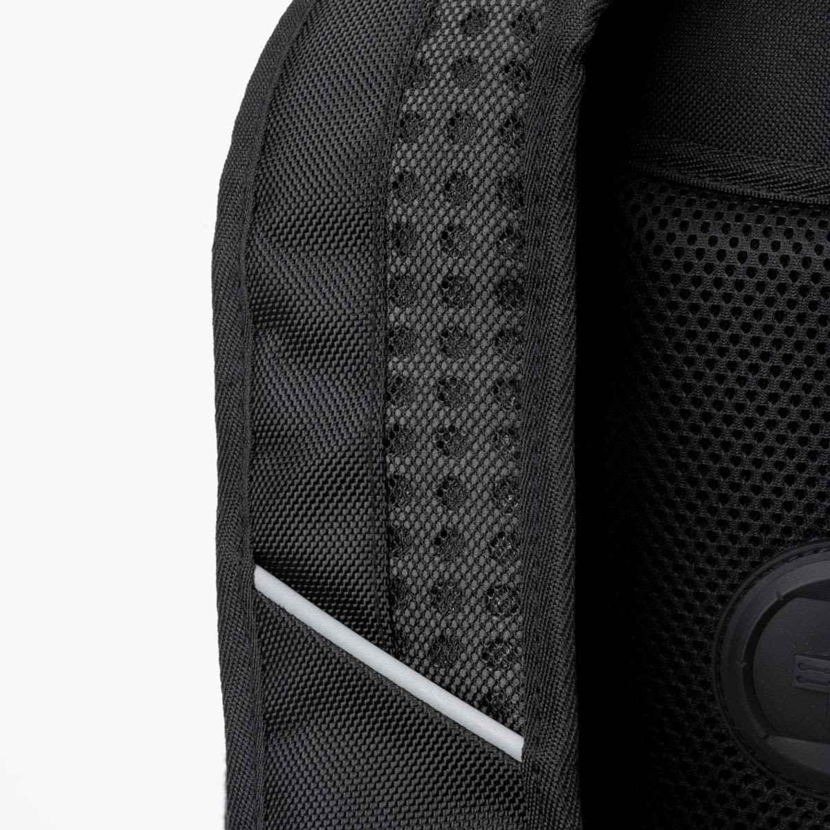Close-up of a black backpack featuring a textured mesh panel and a circular branding logo.