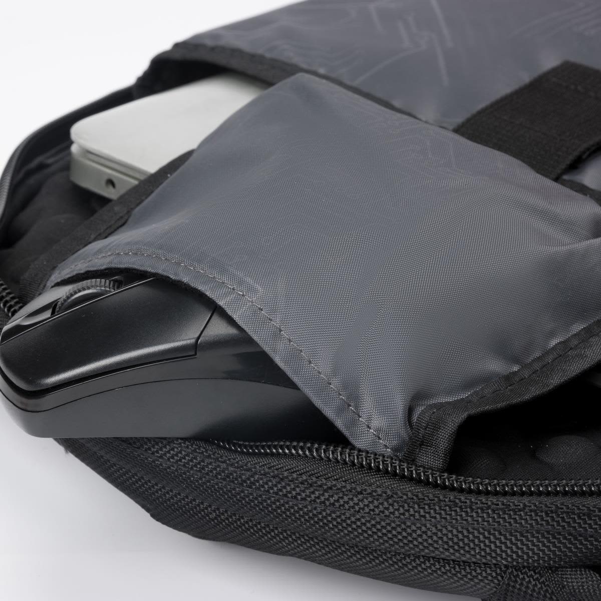 A grey backpack with a laptop compartment and a black mouse nestled inside. It features a branded logo.