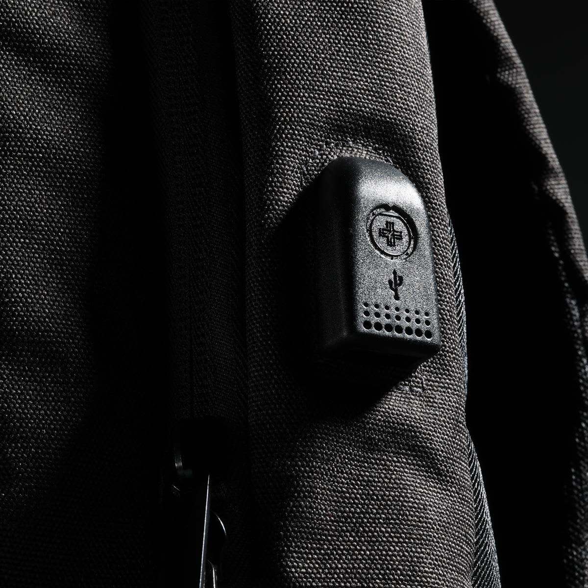 A black backpack with a textured surface and a small logo integrated into the design.