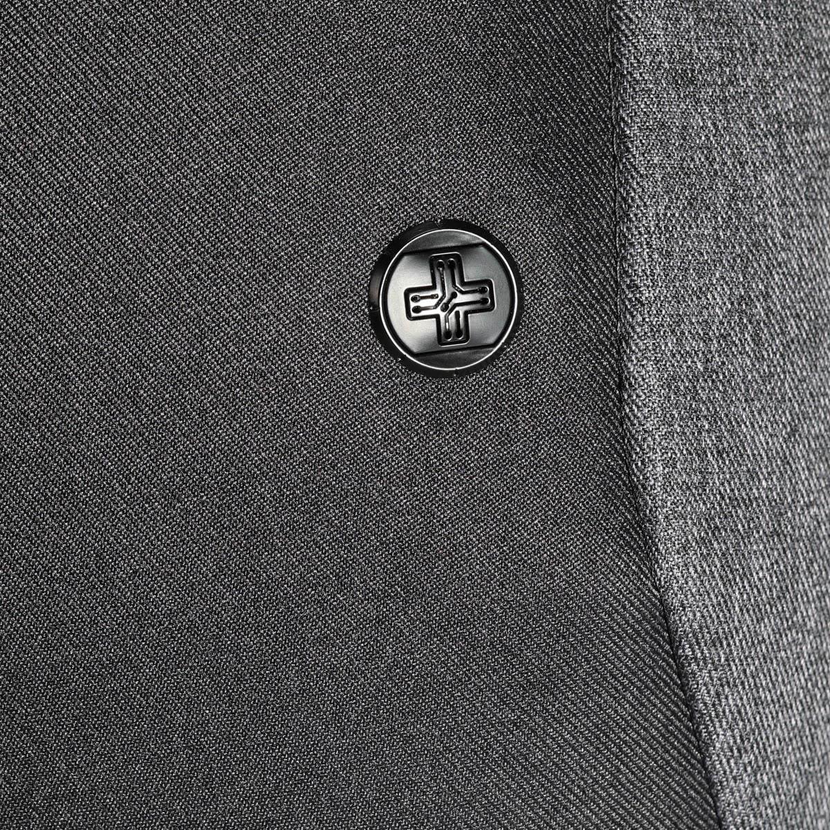 A close-up of a black button on a grey fabric, featuring a simple embossed design.