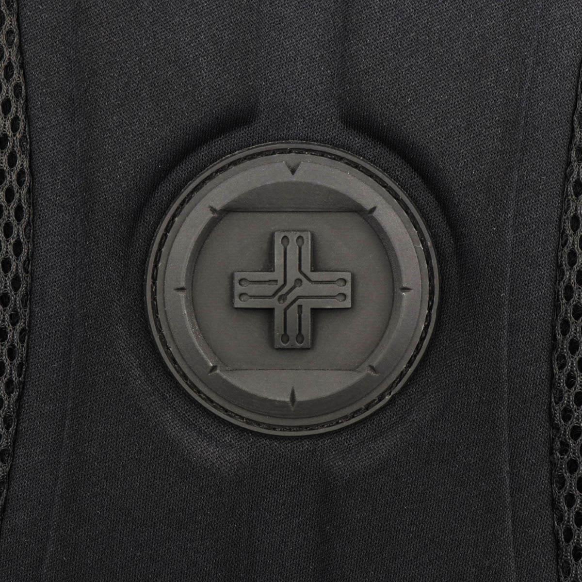 A close-up of a black backpack featuring a round logo with a minimalist design.