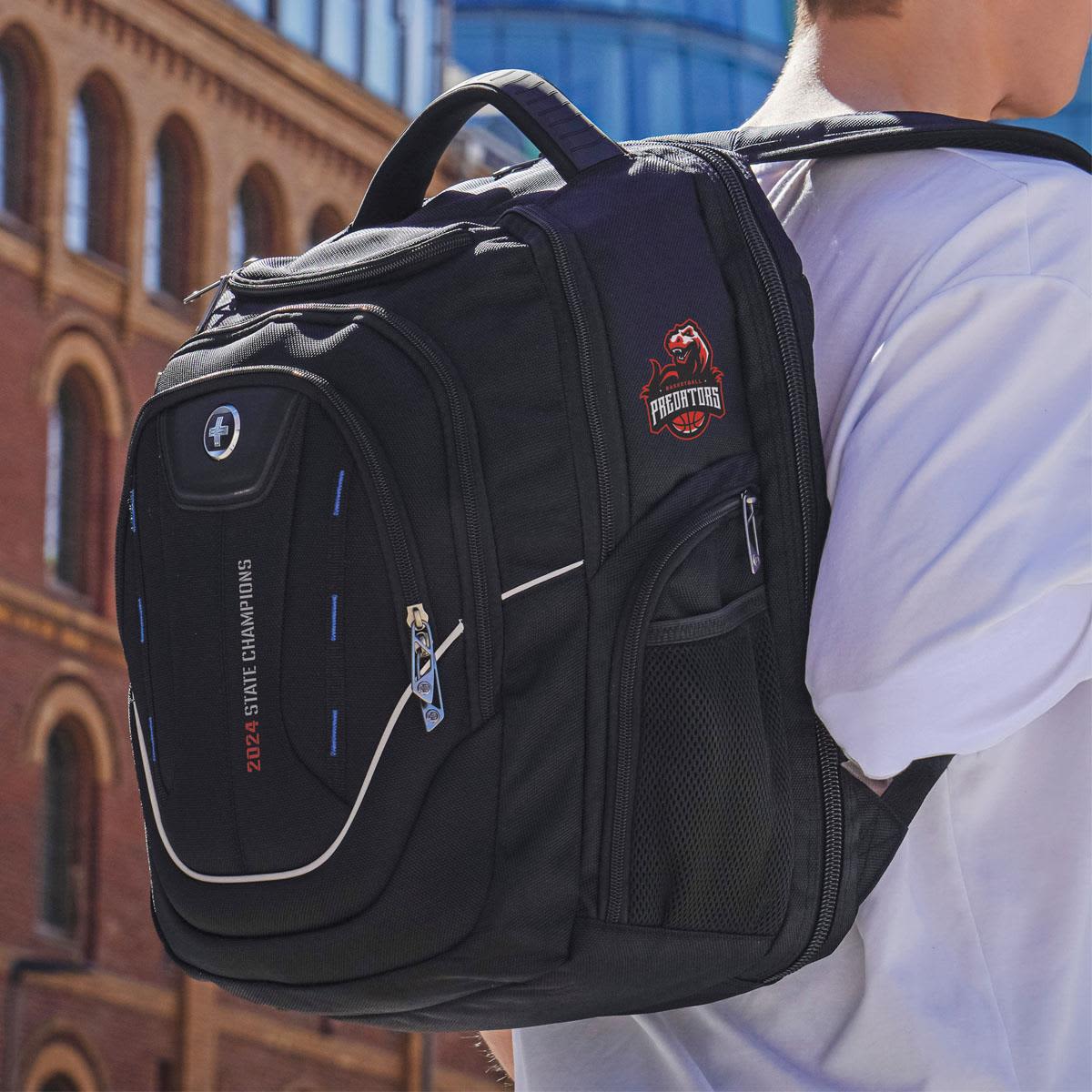 A black backpack with multiple compartments and a logo, featuring zippered pockets and padded straps.