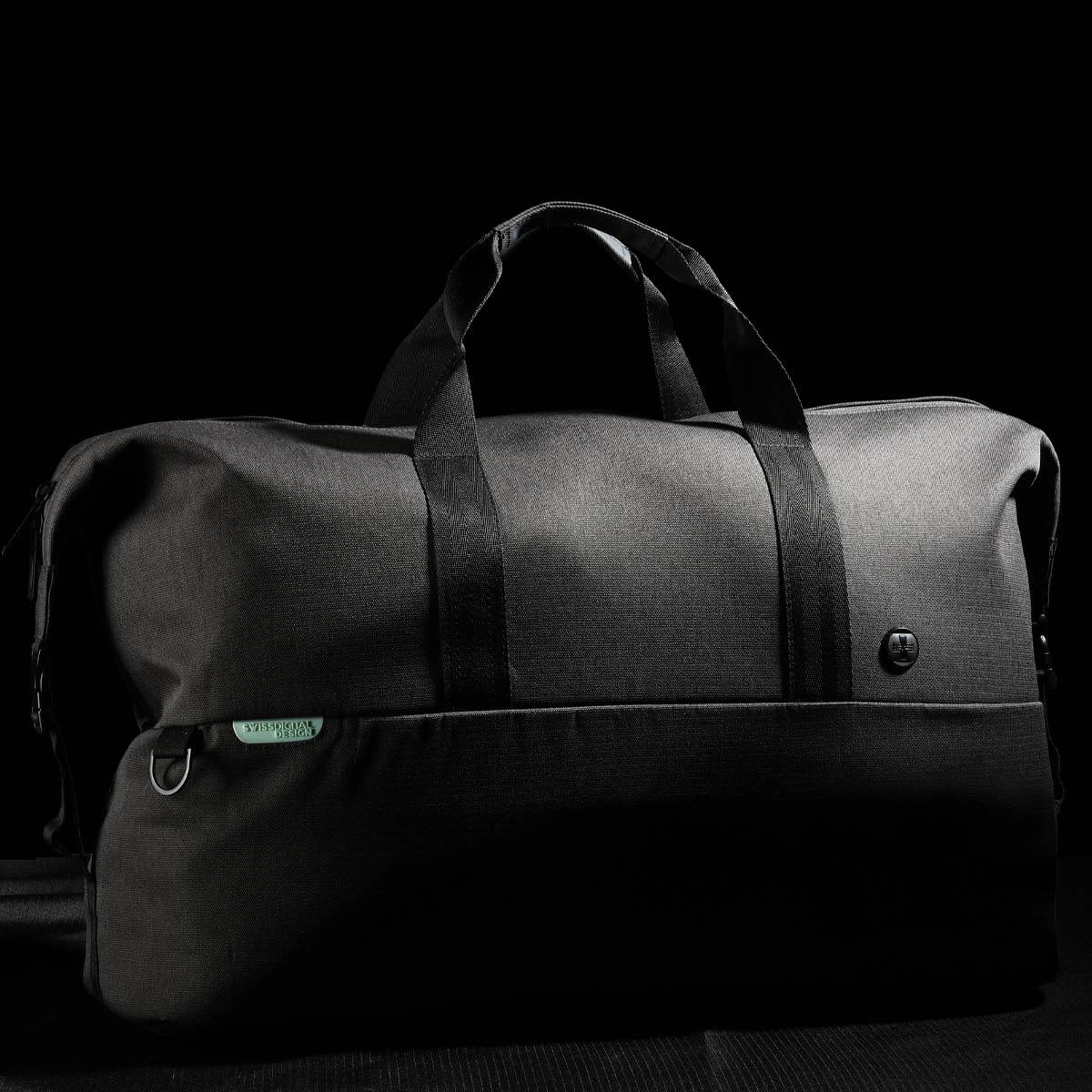 A black duffle bag with dual handles and a logo, featuring a sleek design and spacious interior.