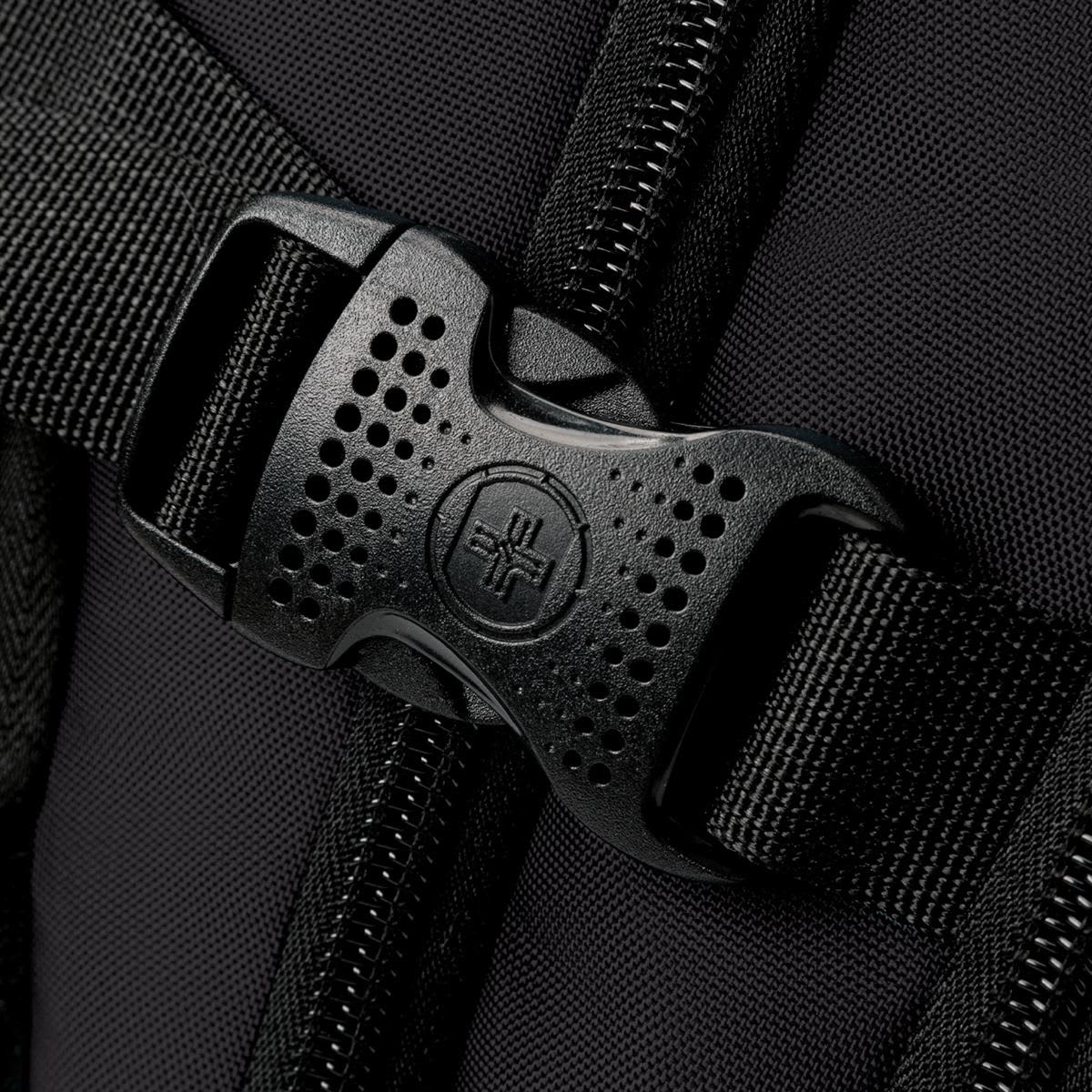 A close-up of a black buckle and strap on a backpack, showcasing its sturdy design and material.
