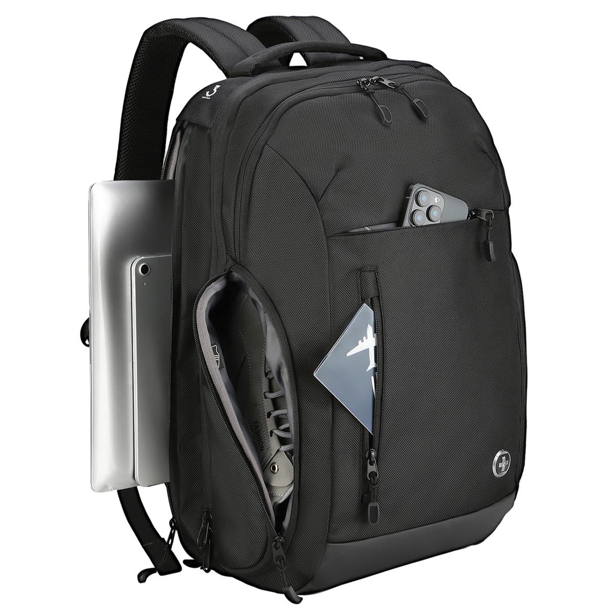 A black backpack with multiple compartments and a laptop sleeve, featuring a logo and various items tucked inside.