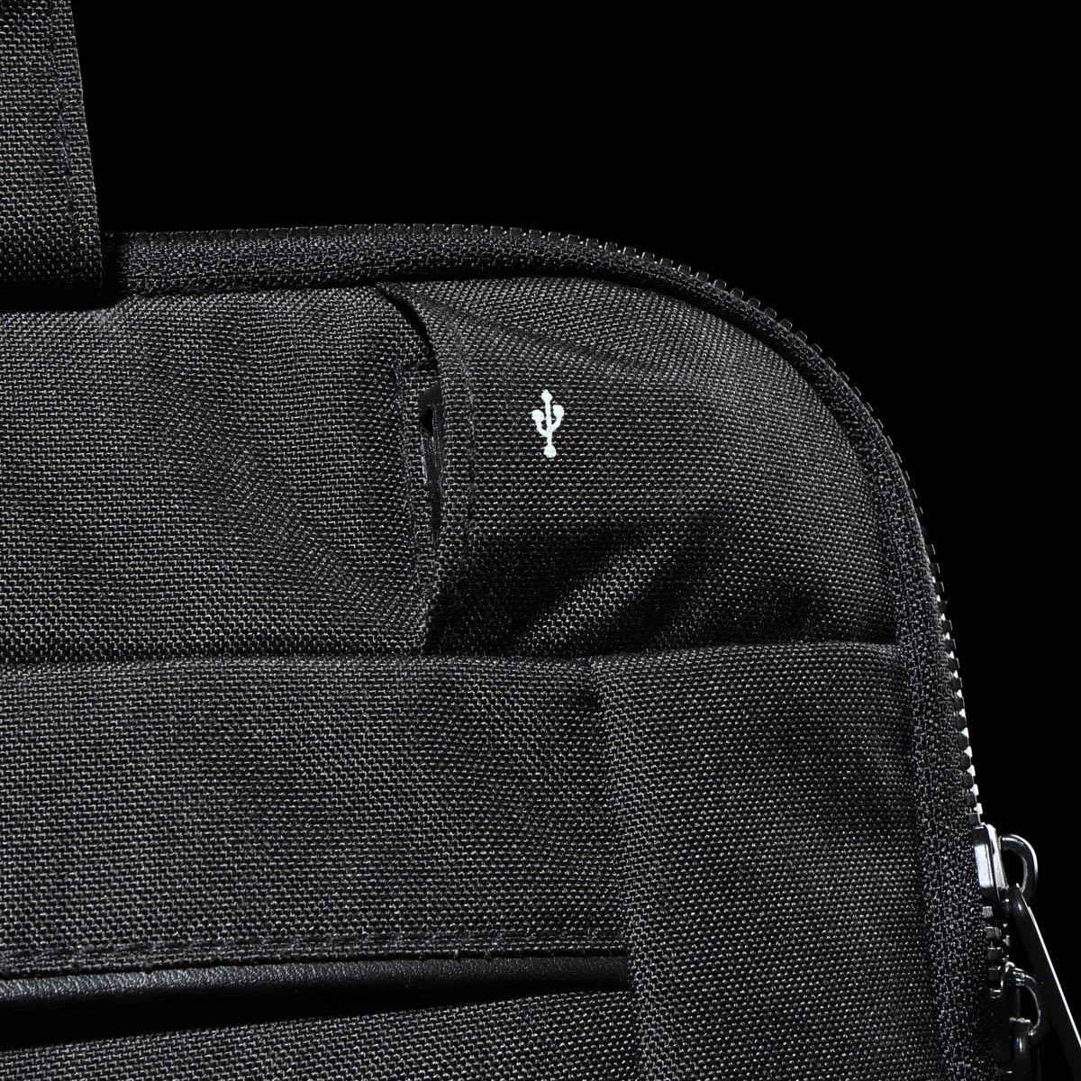 A black laptop sleeve featuring a small logo, showcasing a textured fabric and zip closure.