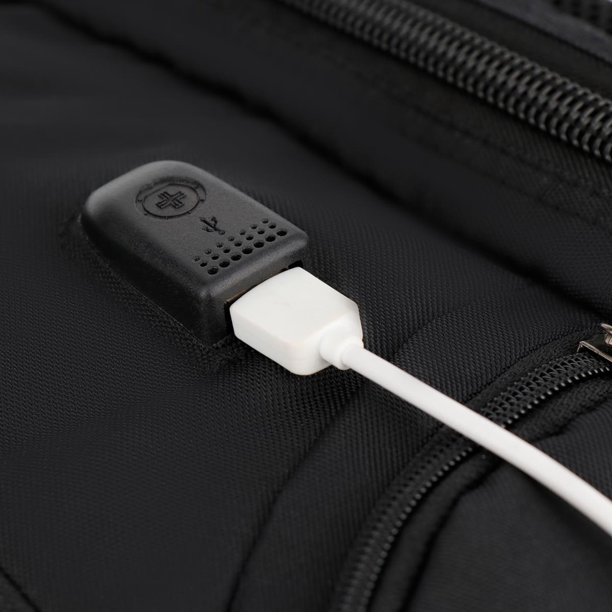 A black backpack featuring a USB charging port, made from durable fabric with a sleek design.