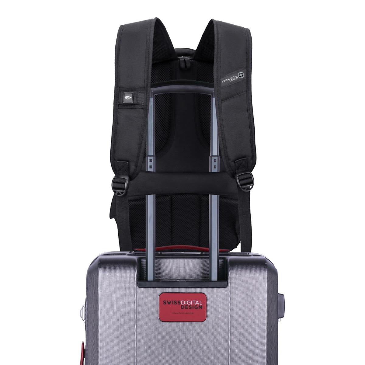 A black Swissdigital Pixel Backpack is attached to a silver trolley suitcase, featuring adjustable straps and a logo.
