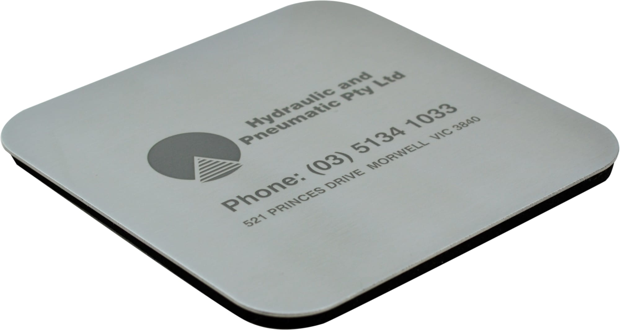 A square metallic coaster featuring a logo and contact information, with a black underside.