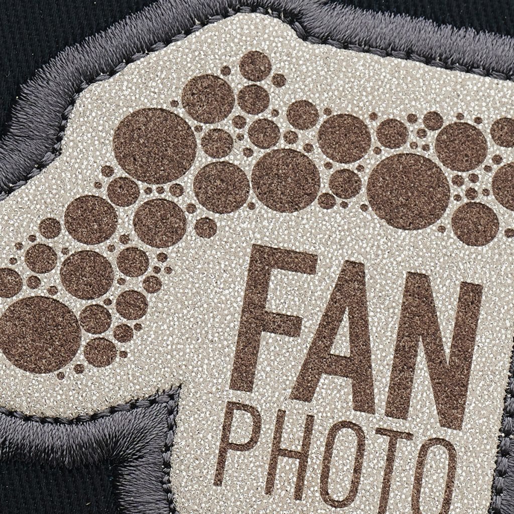 Minimalist version of the Fan Photo patch using tonal SupaEtch finish on a dark grey backpack.