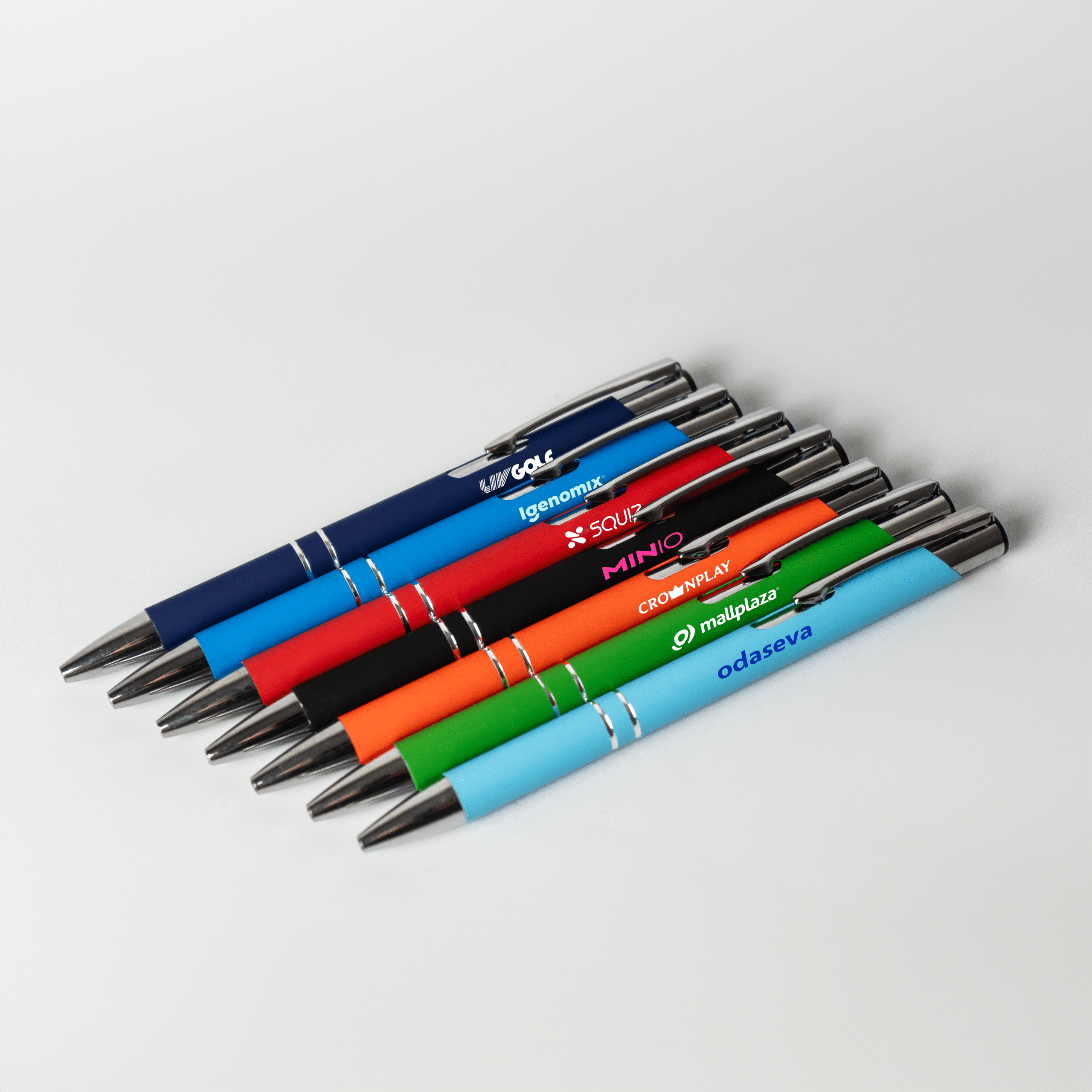 Colourful promotional pens with custom printed logos, showcasing branded merchandise for corporate giveaways and marketing campaigns.