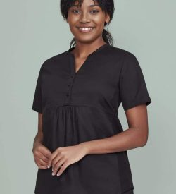 A black women's tunic scrub top with a buttoned front and a relaxed fit, featuring a logo.